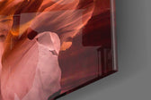 Canyon artwork anchoring a wall with warm panoramic palette