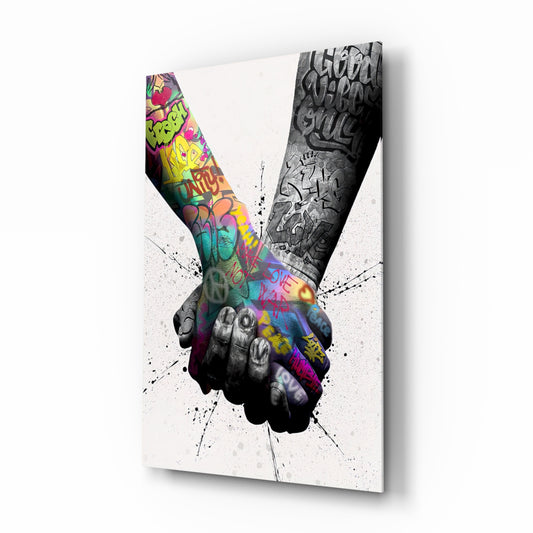 Hand in Hand glass wall art displayed above a console in a designer interior
