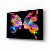Butterfly Silhouettes glass wall art displayed above a console in a designer interior