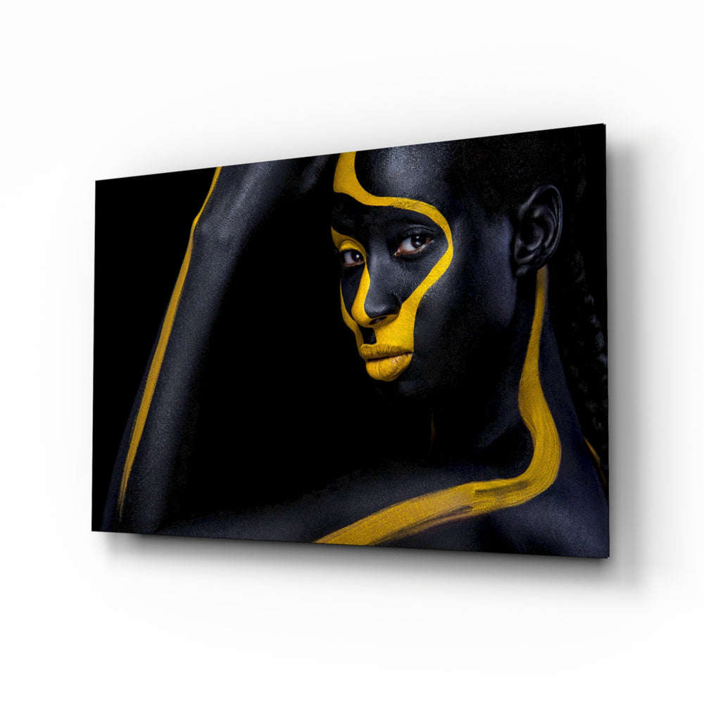 Gold Woman glass wall art displayed above a console in a designer interior