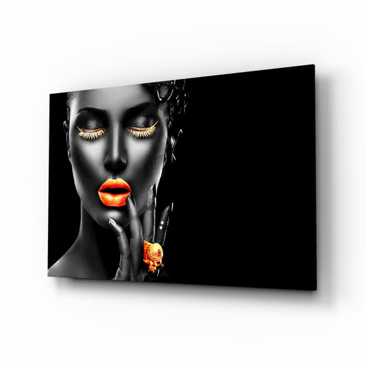 The Power of Orange glass wall art displayed above a console in a designer interior