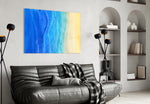 Sea Sand glass wall art styled above a bed in a serene bedroom
