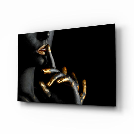 Silence glass wall art displayed above a console in a designer interior