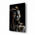 Gold Woman glass wall art displayed above a console in a designer interior