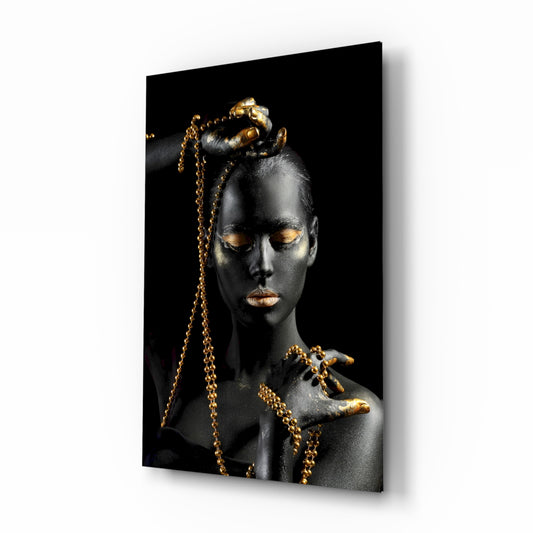 Gold Woman glass wall art displayed above a console in a designer interior