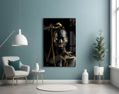 Gold Woman glass wall art styled above a vanity in a powder room