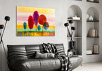 Colorful Trees glass wall art styled above a desk in a child's room