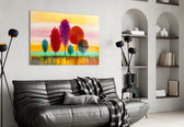 Colorful Trees glass wall art styled above a desk in a child's room