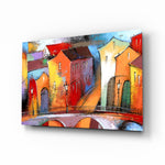 Colorful Houses glass wall art displayed above a console in a designer interior