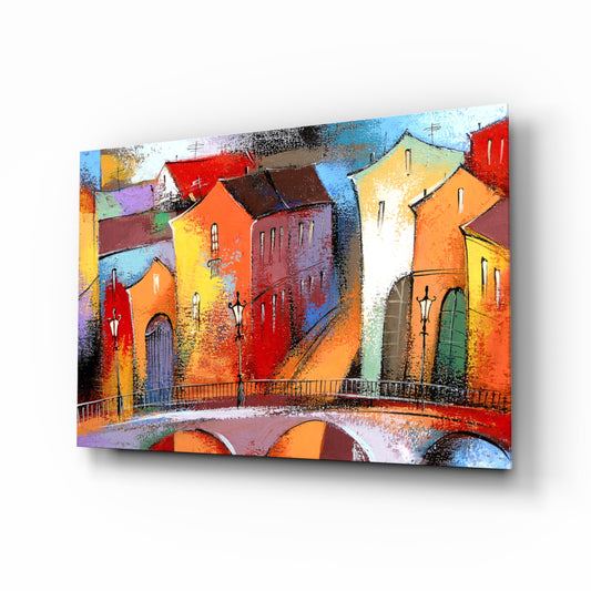 Colorful Houses glass wall art displayed above a console in a designer interior