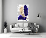 Close-up detail of indigo calla against gold-line fern