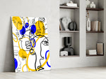 Abstract Faces glass print enhancing an art studio with editorial spirit