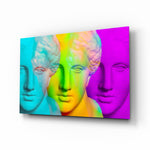 Colorful Statues glass wall art displayed above a console in a designer interior
