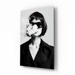 Smoke glass wall art displayed above a console in a designer interior