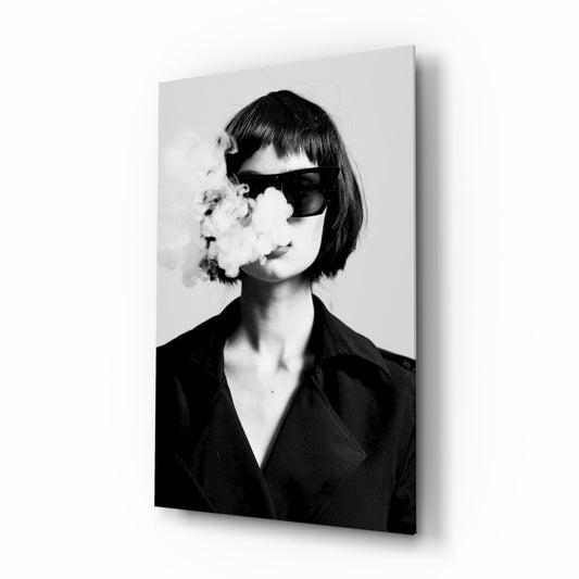 Smoke glass wall art displayed above a console in a designer interior
