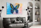 Butterfly glass wall art styled above a bed in a child's room