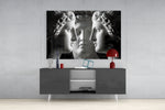 Three Muses panel catching gallery light to reveal its tactile carve