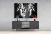 Three Muses panel catching gallery light to reveal its tactile carve