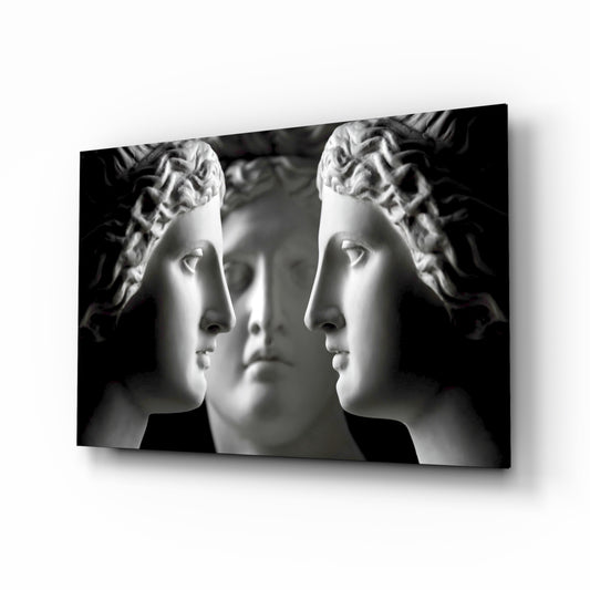 Three Muses glass wall art displayed above a console in a designer interior