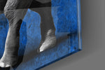 Cobalt Elephant artwork anchoring a wall with bold scholarly palette
