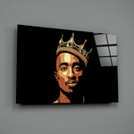 Close-up detail of Tupac with crown behind glass