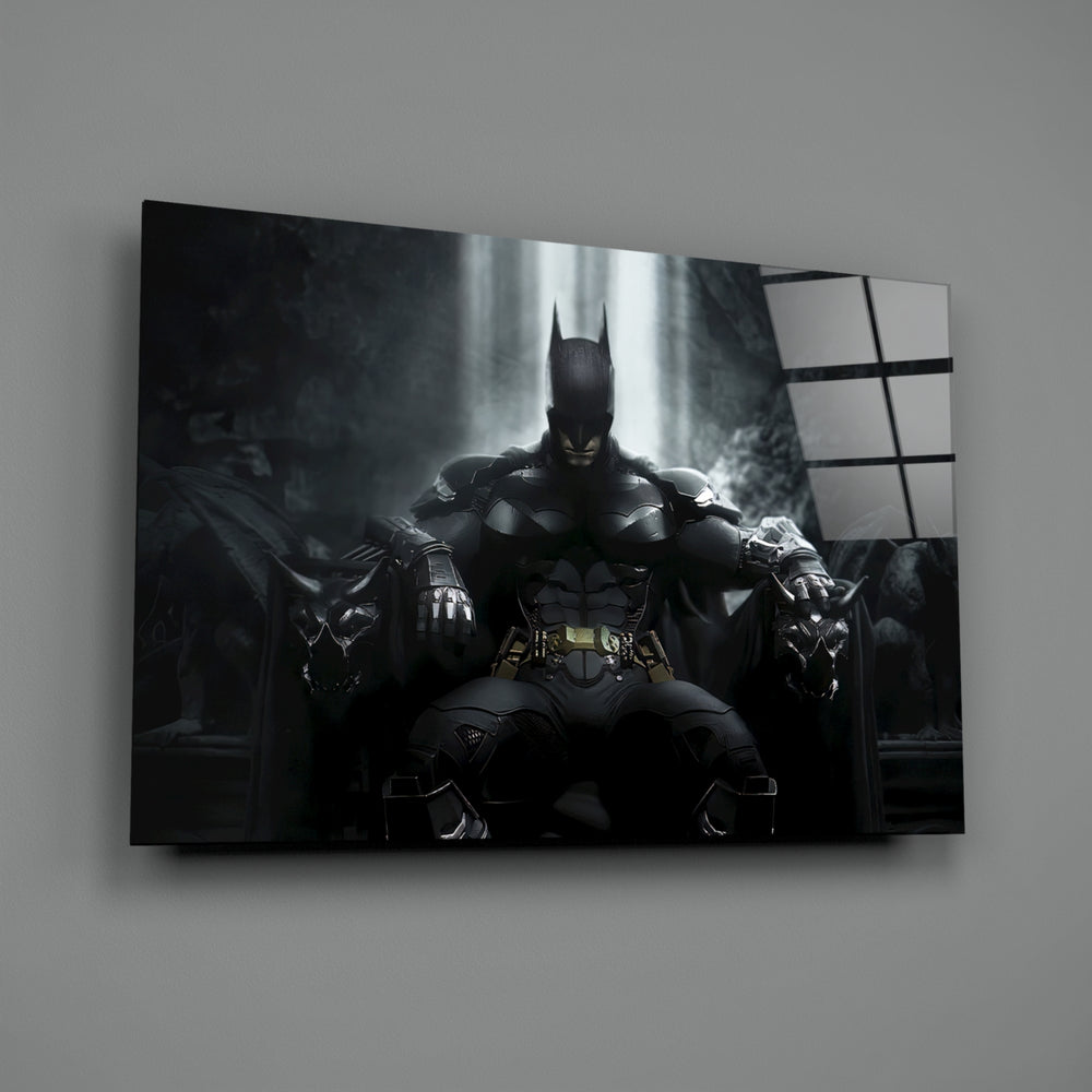 Close-up detail of armored Batman on stone throne behind glass