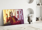 Close-up detail of Joaquin Phoenix Joker with typography behind glass