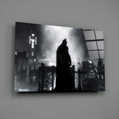 Close-up detail of silhouetted Batman in Gotham rain behind glass