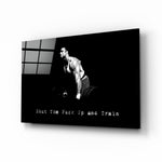 Gym-motivation panel anchoring a man cave wall