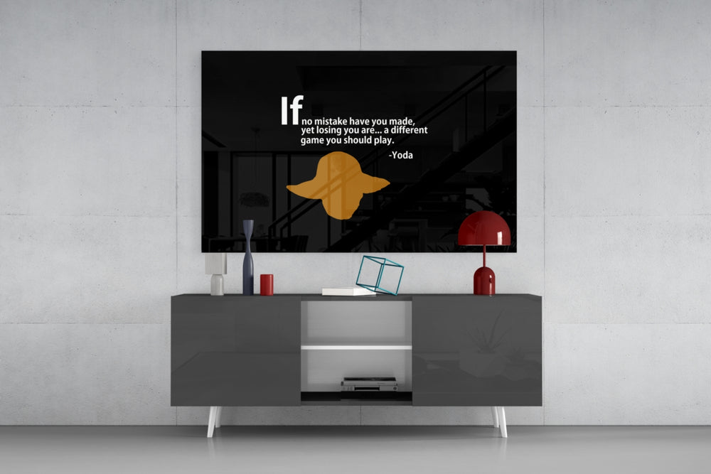Words of Yoda glass wall art catching light to reveal its painted quote