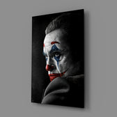 Close-up detail of Joaquin Phoenix Joker with mantra behind glass