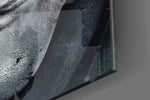 Comic Joker Grin glass wall art catching light to reveal its painted teeth