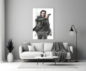 Close-up detail of John Wick with pistol behind glass