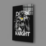 Close-up detail of comic Batman with canary symbol behind glass
