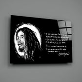 Close-up detail of sketch Bob Marley with quote behind glass