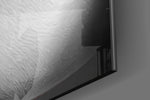 Burn the Money glass wall art catching light to reveal its painted smoke
