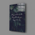 Close-up detail of palm fronds with handwritten quote behind glass