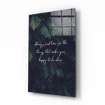 Botanical typography panel anchoring a tropical living room wall