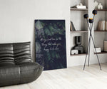 Botanical panel against a moody dark-painted accent wall