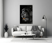 Close-up detail of B&W lion with quote behind glass