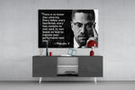 Words of Malcolm X glass wall art catching light to reveal its painted detail