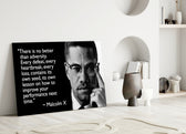 Close-up detail of Malcolm X with quote behind glass