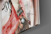 Harley Quinn glass wall art catching light to reveal its painted clippings