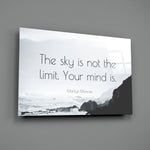 Close-up detail of misty coastline with quote behind glass