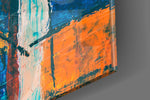 Orange Dream glass wall art catching light to reveal its painted impasto