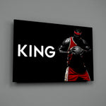 Close-up detail of LeBron with ball and King typography behind glass
