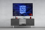 Words of Benjamin Franklin glass wall art catching light to reveal its painted glow