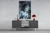 Bronze Buddha glass wall art catching light to reveal its painted smoke