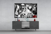 Guernica glass wall art catching light to reveal its painted plane