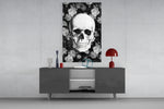 Skull glass wall art catching light to reveal its painted petals